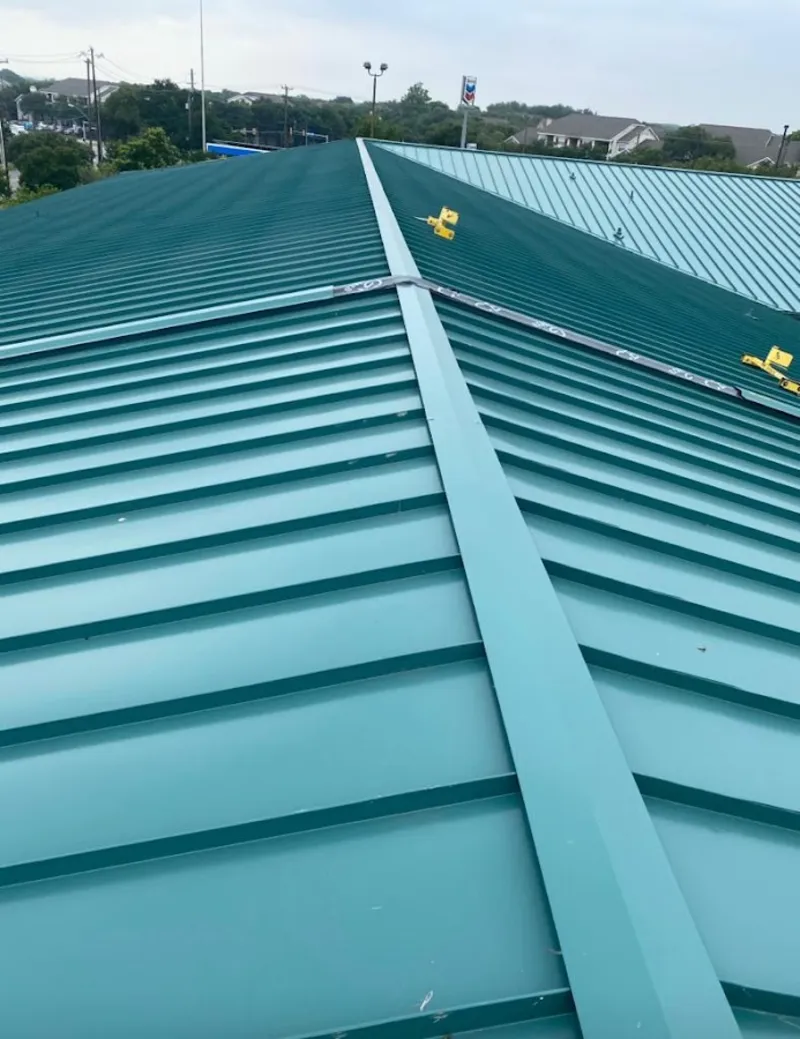 Green commercial metal roof ridge and valley for Metal Roof Repair in Maine